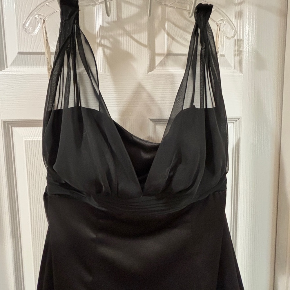 A black bridesmaid dress from David’s Bridal. Purchased 2016 and only worn once.